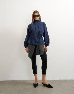 Model wearing High neck toggle detail jacket in navy