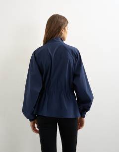 Model wearing High neck toggle detail jacket in navy