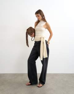 Model wearing High neck top with tie detail in buttermilk