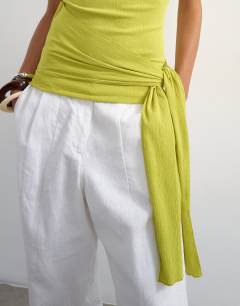 Model wearing High neck top with tie detail in green