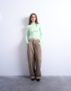 Model wearing High neck viscose long sleeve top in mint geen