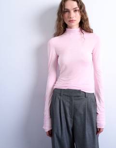 Model wearing High neck viscose long sleeve top in pink