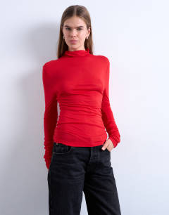 Model wearing High neck viscose long sleeve top in red
