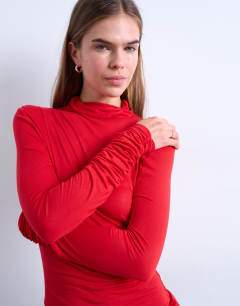 Model wearing High neck viscose long sleeve top in red