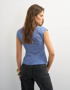 Model wearing High neck zip detail top in cornflower blue stripe