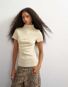Model wearing High neck zip through short sleeve rib top in cream