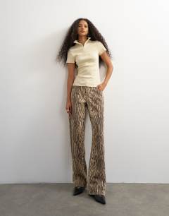 Model wearing High neck zip through short sleeve rib top in cream