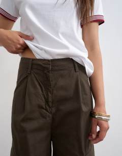 Model wearing High rise barrel leg trousers with pleat in brown