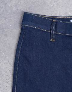 Model wearing High rise skinny jean in indigo rinse