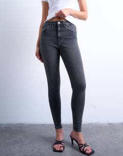 Model wearing High rise skinny jean in washed black