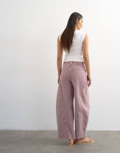 Model wearing High rise utility barrel jean in lilac
