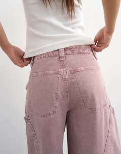 Model wearing High rise utility barrel jean in lilac