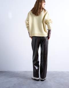 Model wearing High shine high waist faux leather pleated straight leg trouser  in brown
