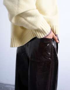 Model wearing High shine high waist faux leather pleated straight leg trouser  in brown