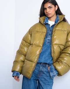 Model wearing High shine mid length puffer jacket in khaki