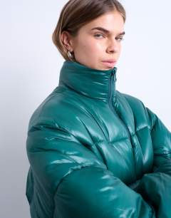 Model wearing High shine mid length puffer jacket in teal