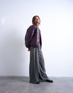 Model wearing High shine padded bomber jacket in aubergine
