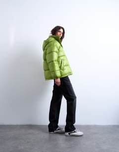 Model wearing High shine ripstop funnel neck puffer jacket in bright green