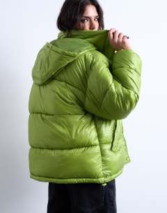 Model wearing High shine ripstop funnel neck puffer jacket in bright green