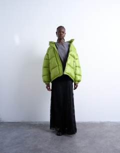 Model wearing High shine ripstop puffer jacket in bright green