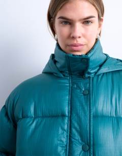Model wearing High shine ripstop puffer jacket in teal
