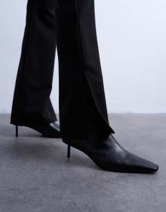 Model wearing High waisted split flare trouser in black