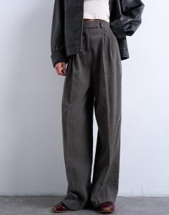 Model wearing High waisted two pleat herringbone pleated front trouser in grey