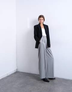 Model wearing High waisted two pleat tailored trouser in light grey