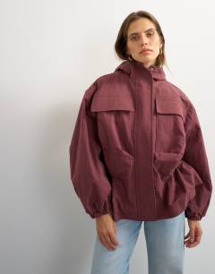 Model wearing Hooded cinch waist anorak in blackberry