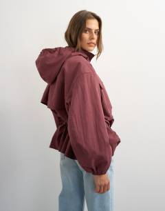 Model wearing Hooded cinch waist anorak in blackberry