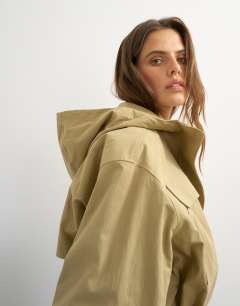 Model wearing Hooded cinch waist anorak in camel