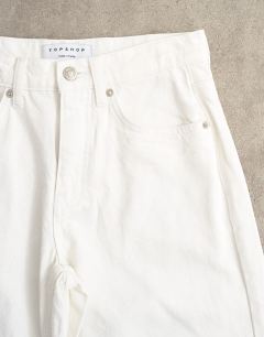 Model wearing Horizon mid rise wide leg jean white