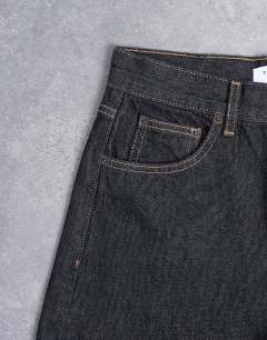 Model wearing Horizon wide leg jeans in black rinse