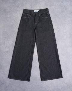 Model wearing Horizon wide leg jeans in black rinse