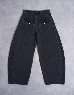 Model wearing Horseshoe high rise barrel jean circular design in washed black