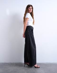 Model wearing Horseshoe mid rise barrel jean in washed black