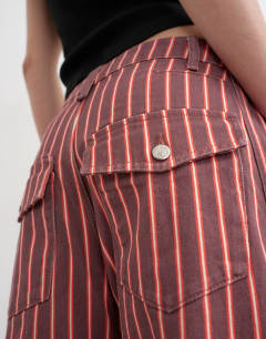 Model wearing Horseshoe mid rise jean in pink and red stripe