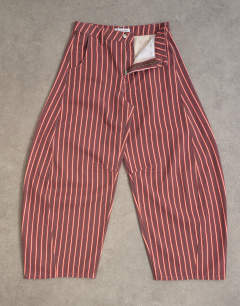 Model wearing Horseshoe mid rise jean in pink and red stripe