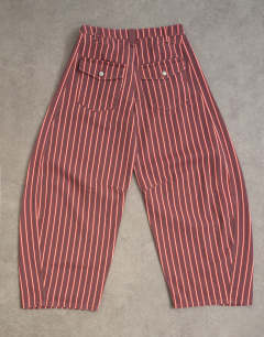 Model wearing Horseshoe mid rise jean in pink and red stripe