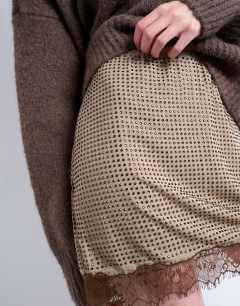 Model wearing Hot fix embellished mini skirt with lace trim in brown