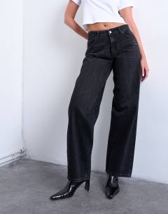 Model wearing Hourglass Cinch relaxed jean in washed black