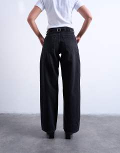 Model wearing Hourglass Cinch relaxed jean in washed black