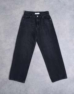 Model wearing Hourglass Cinch relaxed jean in washed black