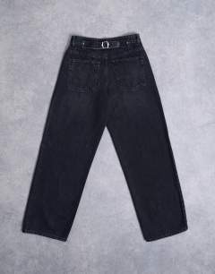 Model wearing Hourglass Cinch relaxed jean in washed black