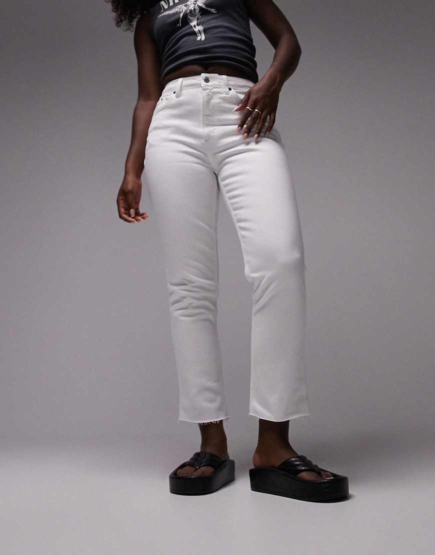 cropped mid rise straight jeans with raw hems in white