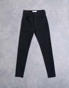 Model wearing Hourglass Jamie high rise skinny jean in black