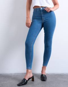 Model wearing Hourglass Joni high rise super skinny jean in mid blue