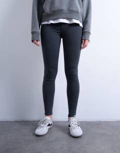 Model wearing Joni skinny high rise jean in washed black
