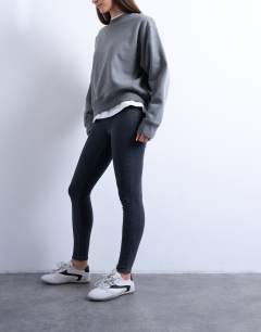 Model wearing Joni skinny high rise jean in washed black