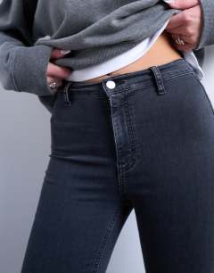 Model wearing Joni skinny high rise jean in washed black